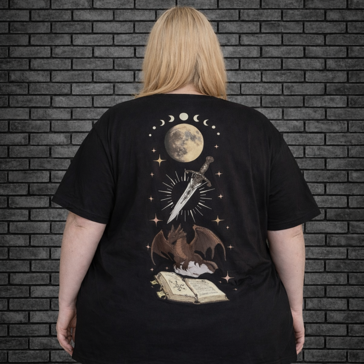 Plus size model wearing black short sleeve shirt with back design of sword, moon, dragon and book