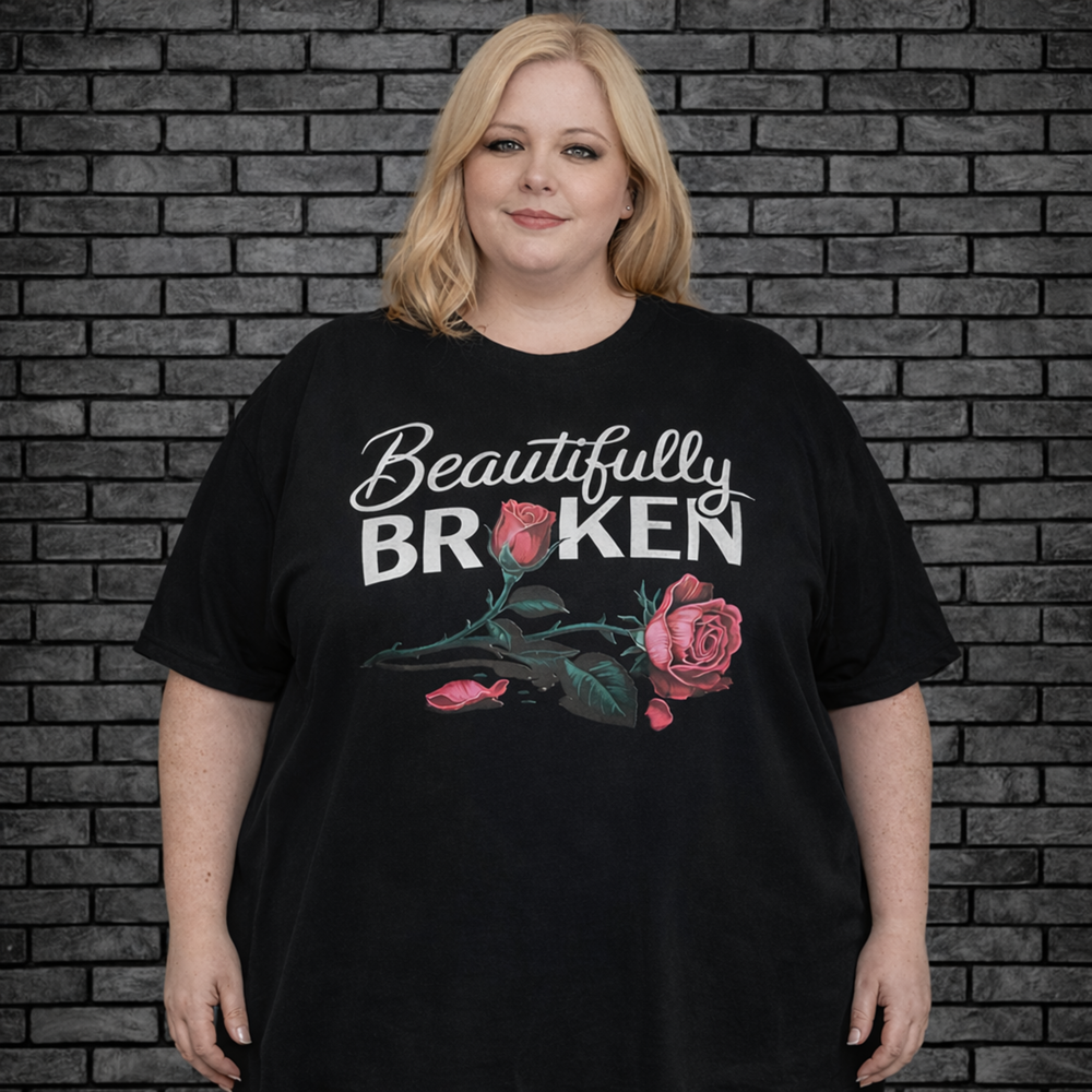 Plus size model wearing black short sleeve shirt saying Beautifully Broken with a rose
