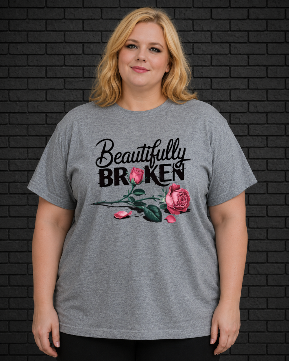 Plus size model wearing grey crew neck shirt with Beautifully Broken design