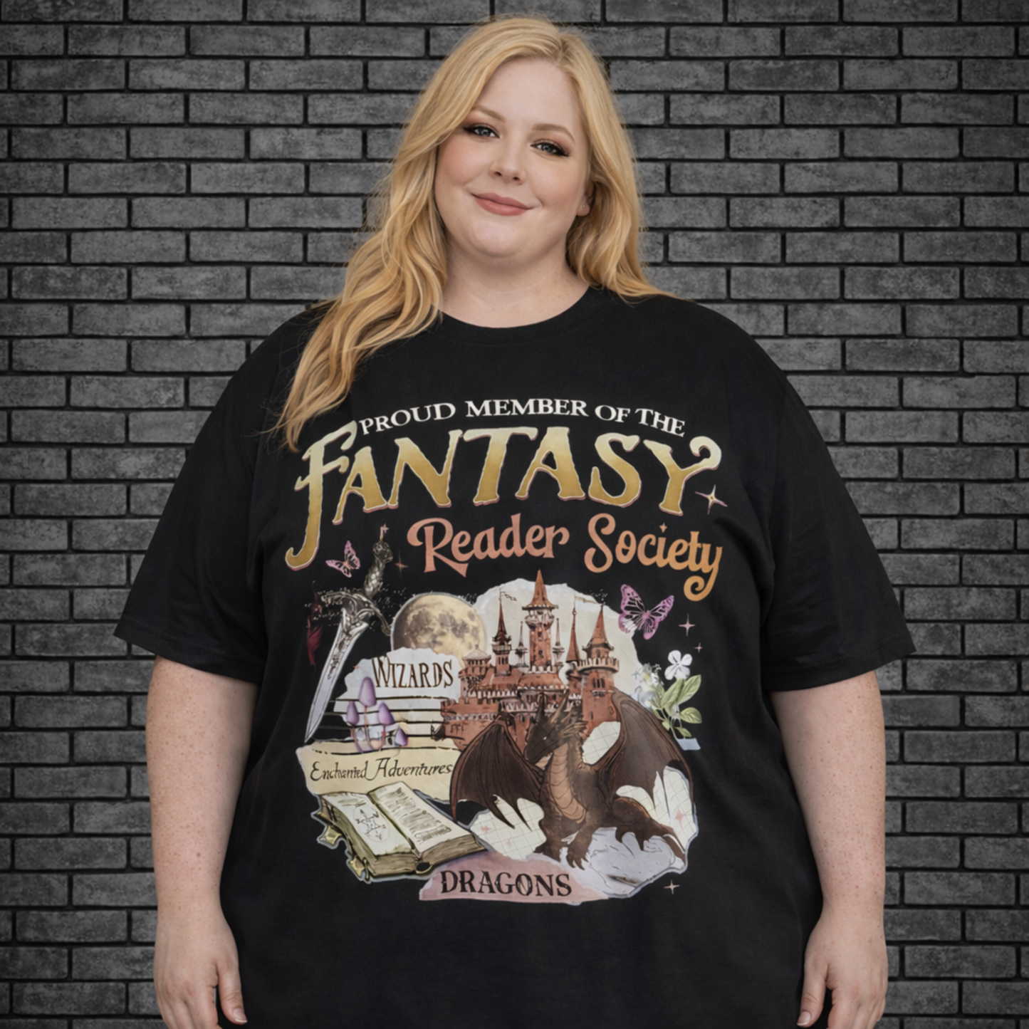 Plus size model wearing black short sleeve shirt saying Proud Member of the Fantasy Reader Society with books and dragons